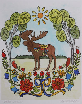 Greta Lann's "Dala Moose" 11x14 print features a brown moose standing on grass between trees under the sun, with vibrant flowers and a blue ribbon in a charming Swedish art style.