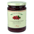A jar with a cream label showing lingonberries and blue and yellow Swedish flags, referencing Scandinavian heritage.