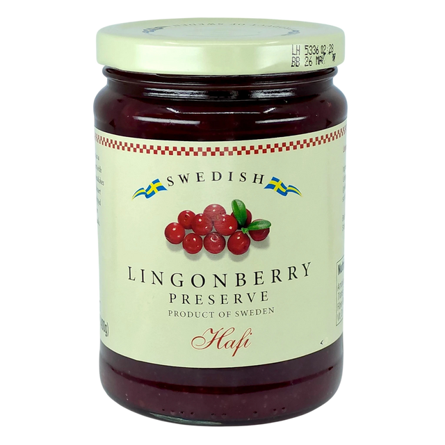 A jar with a cream label showing lingonberries and blue and yellow Swedish flags, referencing Scandinavian heritage.
