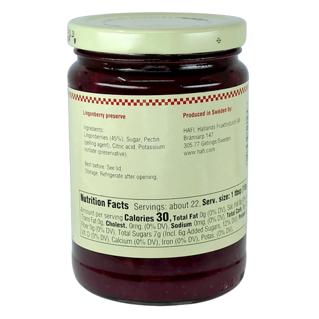 Jar with deep red preserves and a white label showing ingredients, nutrition facts, and storage instructions in English; “Swedish” visible on the packaging.