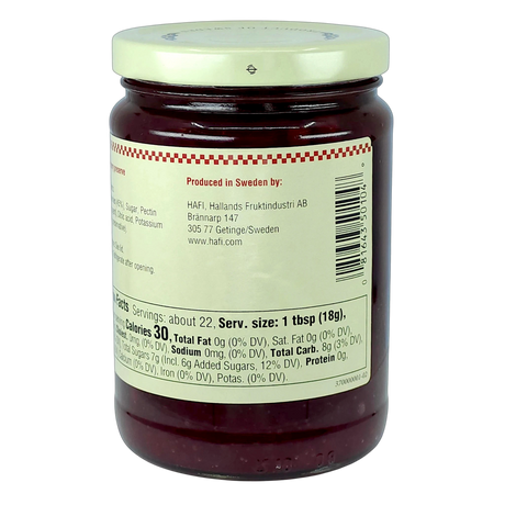 Glass jar with red preserves inside and a white label displaying nutrition facts, details, and the text “Produced in Sweden by Hafi Hallands Fruktindustri AB.”.