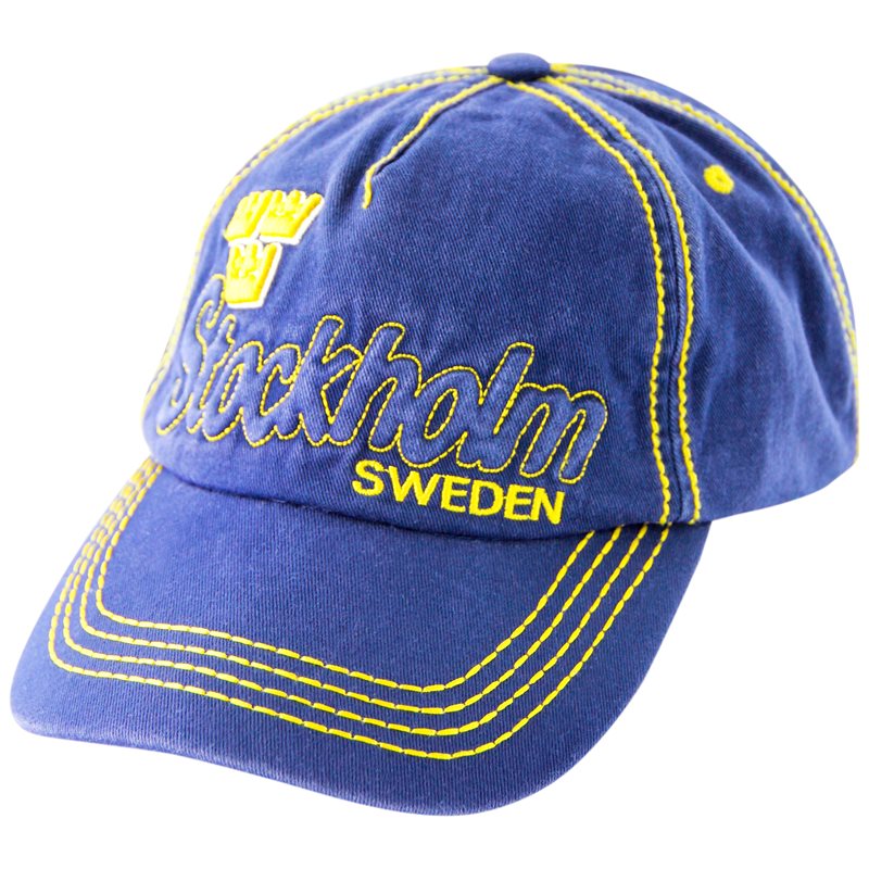 The Stockholm Sweden Navy Embroidered Hat showcases elegant yellow embroidery with a regal crown and Stockholm Sweden text, finished with an adjustable metal clasp for a perfect fit.