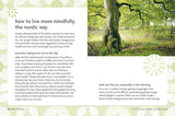 An open spread of Book: Nordic Wisdom Simplify Your Life & Cultivate Well-Being by Elisabeth Carlsson shows mindful living tips. The right page pictures a green Nordic forest with sunlight streaming through the trees.