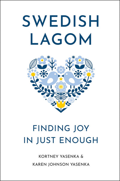 Book: Swedish Lagom - Finding Joy in Just Enough features a blue heart with birds and flowers on the cover, symbolizing mindfulness and balance, with authors Kortney Yasenka & Karen Johnson Yasenka listed at the bottom.