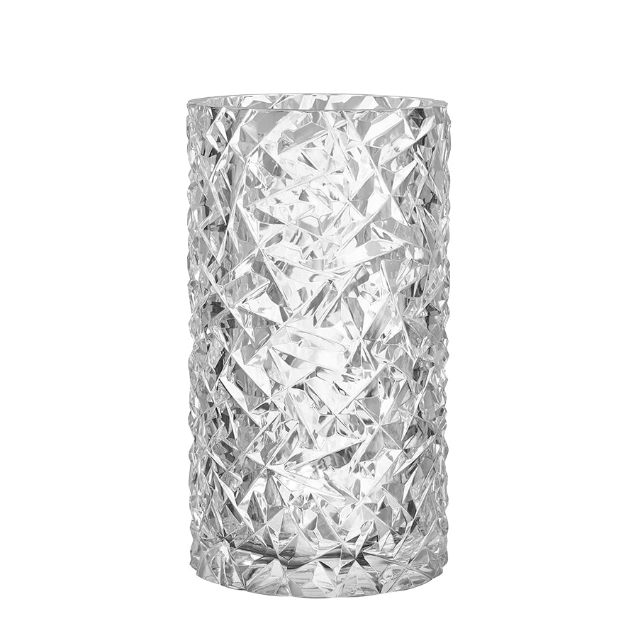 The Orrefors: Carat Hurricane is a textured crystal vase with a cylindrical shape and an intricate faceted pattern similar to cut glass.