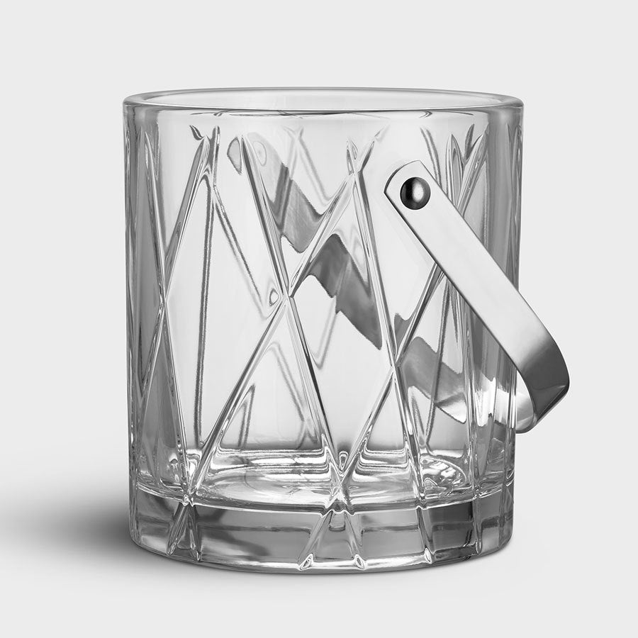 The Orrefors: City Ice Bucket boasts a striking geometric pattern on its crystal glass surface, enhanced by a sleek metal handle.