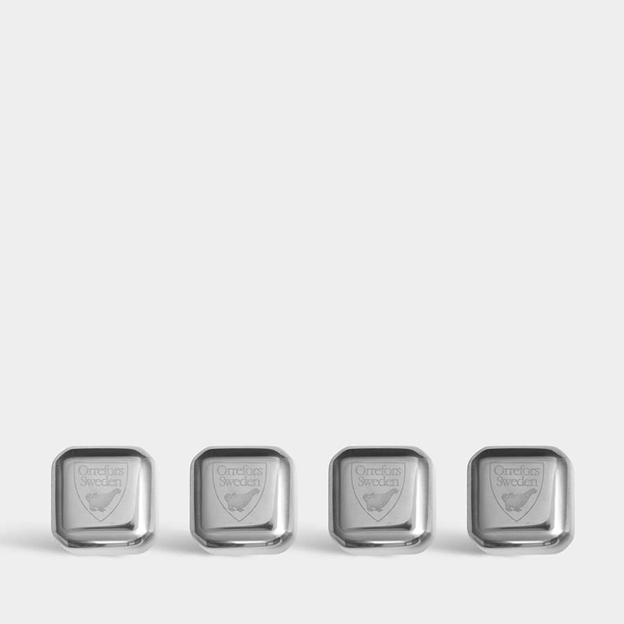 Four silver ice stones, known as Orrefors: City Ice Cubes (4-Pack), are aligned on a white background. Made from stainless steel and engraved with Orrefors Sweden, each one exudes elegance and sophistication.