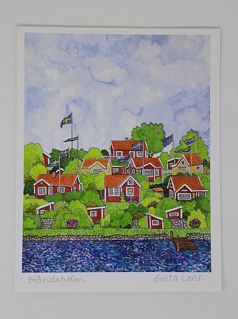 The artwork "Brändaholm" by Greta Lann beautifully depicts a vibrant village with red houses nestled among lush green trees and Swedish flags, adjacent to a glistening body of water. This enchanting scene embodies the spirit of Karlskrona and suggests the presence of Sweden's most picturesque community garden nearby.