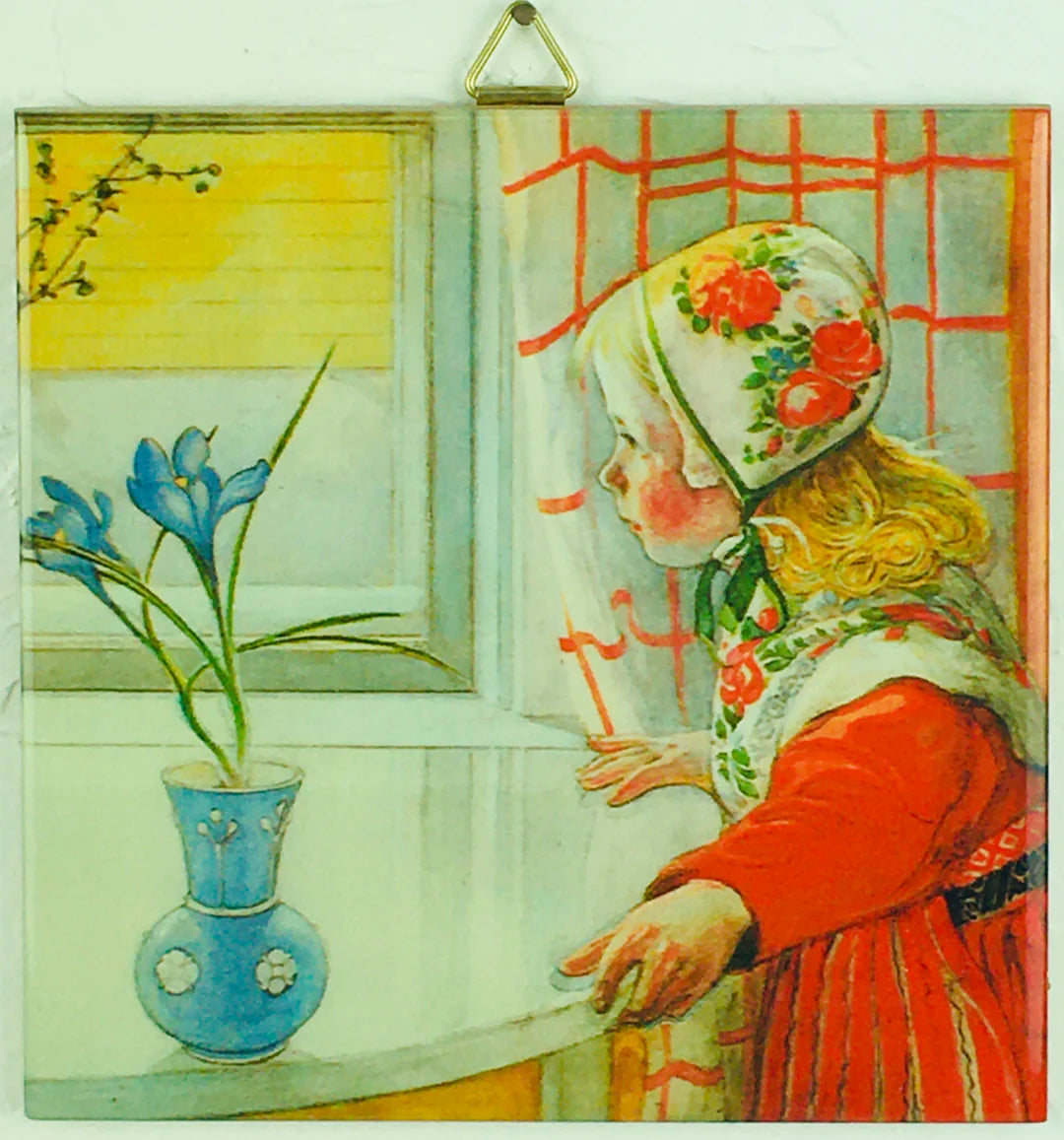 A young girl in traditional clothing gazes out a window beside a blue vase, as depicted on the "Karin at the Window Carl Larsson 6\" Ceramic Tile with Cork Backing & Hanger," inspired by Swedish art decor.