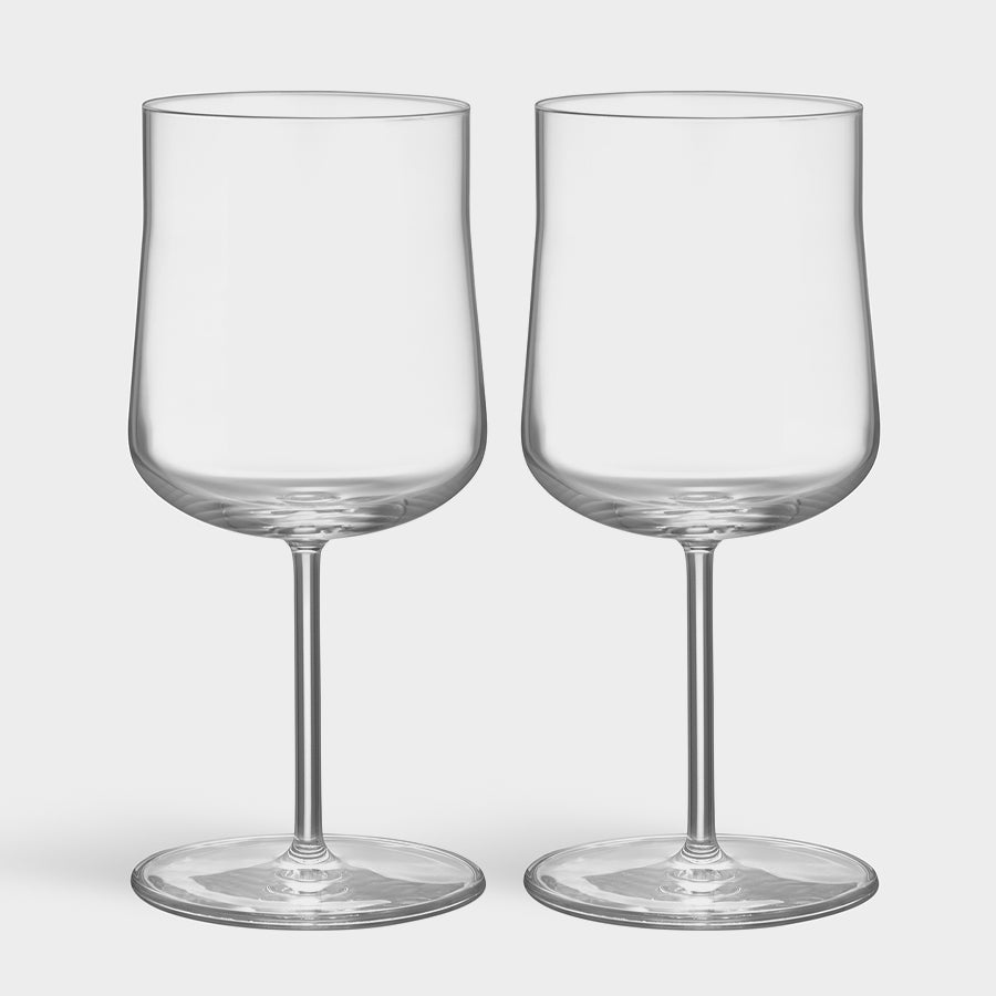 The Orrefors: Informal Glass XL 20oz (2-Pack) presents two elegant, clear wine glasses with long stems against a plain backdrop, embodying Scandinavian minimalist design.