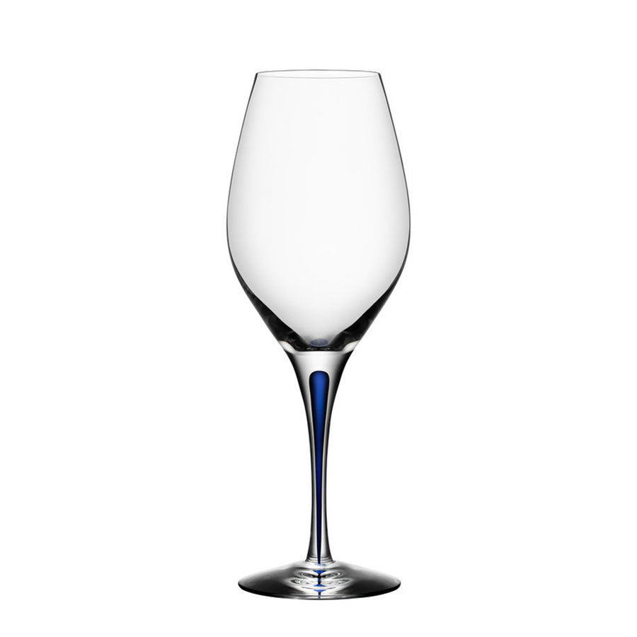 A clear Orrefors wine glass with a blue-tinted slender stem, part of the elegant Intermezzo Blue collection, called the Intermezzo Blue Wine Balance Glass 14oz.