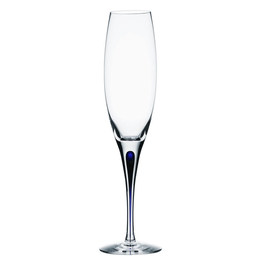 The Orrefors Intermezzo Blue Flute Glass 7oz (2-Pack), designed by Erika Lagerbielke, showcases a tall, clear silhouette with a slender stem and a delicate blue tint at the base.