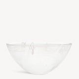 A KostaBoda Contrast Bowl in white with blue and black veining, designed by Anna Ehrner, is set against a plain, light background.