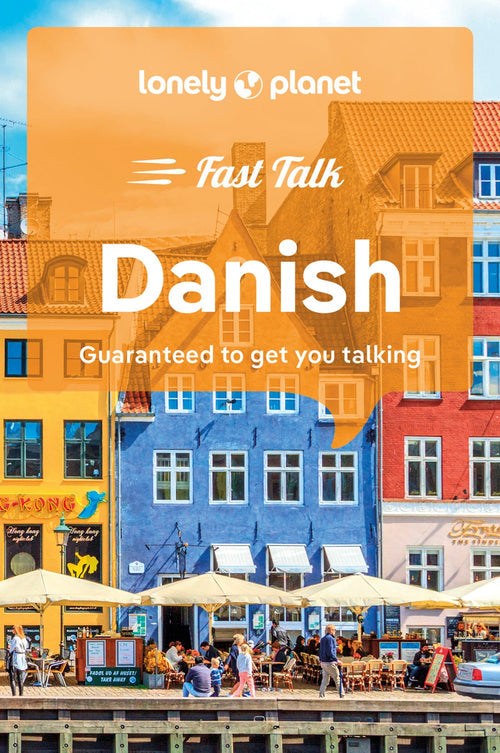 Cover of the book titled "Fast Talk Danish - Guaranteed to get you talking" from Lonely Planet, featuring vibrant buildings and outdoor cafes along a canal in Copenhagen. Ideal for travel experiences, this guide includes essential Danish phrases to enrich your journey.