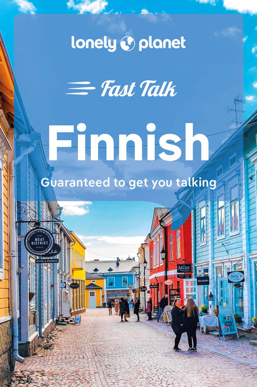 The cover of "Book: Fast Talk Finnish Guaranteed to get you talking" features a vibrant street scene with people strolling between pastel wooden buildings beneath a clear blue sky, perfectly capturing the essence of unique travel experiences.