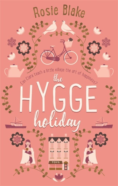 Book cover for "Hygge Holiday (a novel)" by Rosie Blake, set in the enchanting village of Yulethorpe, adorned with charming illustrations of a bicycle, birds, flowers, teapots, and a village scene in calming pink hues.