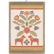 The Tea Towel: Kurbitsblom showcases an embroidered design with two orange dalahorses, flowers, and leaves made from organic cotton. It is highlighted by green, red, and tan borders.