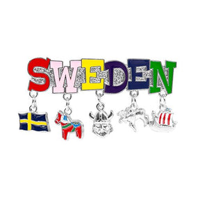 The Sweden Magnet showcases five delightful charms: a blue and yellow flag, a red Dala horse, a Viking helmet, an elk, and a Viking ship.