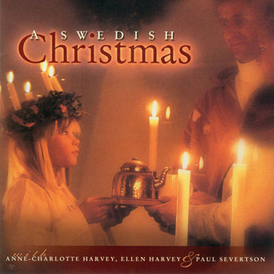 The CD Swedish Christmas Music for a St Lucia Festival features a cover with a girl holding a teapot, surrounded by candles. Enjoy the magic of traditional Swedish songs with Anne-Charlotte Harvey, Ellen Harvey, and Paul Severtson.