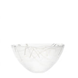 The KostaBoda Contrast Bowl, designed by Anna Ehrner, showcases white glass with striking blue and black veining, pictured against a plain white background.