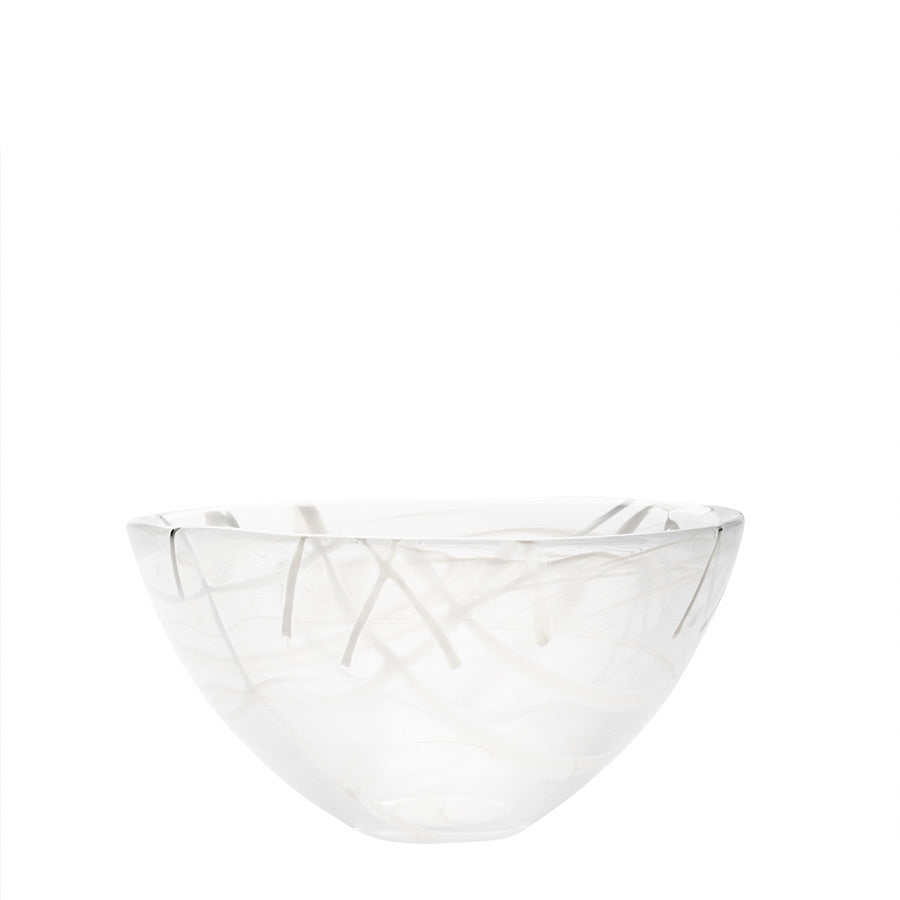 The KostaBoda: Contrast Bowl White, crafted by Anna Ehrner, is a clear glass masterpiece featuring a round base adorned with abstract white swirl patterns beautifully displayed against a plain white backdrop.