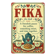 Vintage metal wall sign featuring the word “FIKA” with its definition, illustrations of coffee, cinnamon rolls, and floral Scandinavian-style mugs.