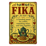 Vintage metal sign with the word FIKA, its pronunciation, and a definition of a Swedish coffee break, illustrated with a teapot, two mugs, and a cinnamon bun.