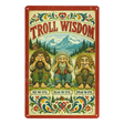 Scandinavian-style sign featuring three trolls in see no evil, hear no evil, speak no evil poses by mountains, with “Troll Wisdom” text, flowers, and heart motifs.