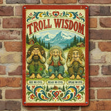 Scandinavian metal sign featuring three trolls posing see no evil, hear no evil, speak no evil with kurbits floral accents and mountains in the background, mounted on brick.