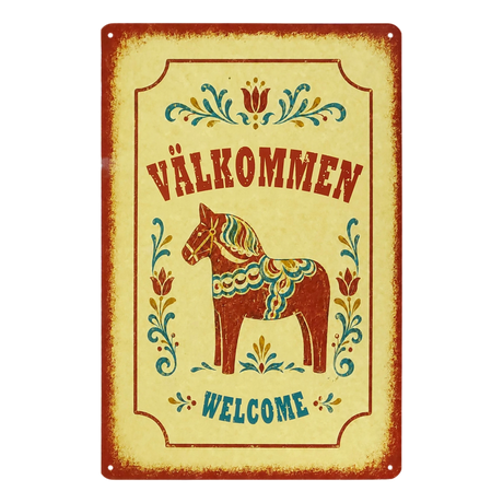 Swedish metal welcome sign displaying “Välkommen” and “Welcome,” with a central painted Dala horse and surrounding floral designs.