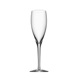 A set of four clear Orrefors: More Champagne 6 oz glasses with long stems is centered on a white background.