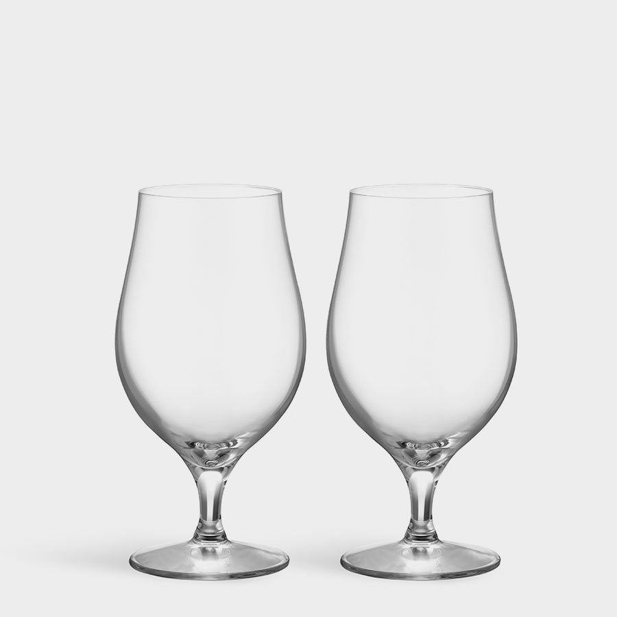 Two Orrefors More Beer Taster Glasses, each 16oz, sit elegantly on a plain white background, showcasing their refined craftsmanship and crystal-clear brilliance.