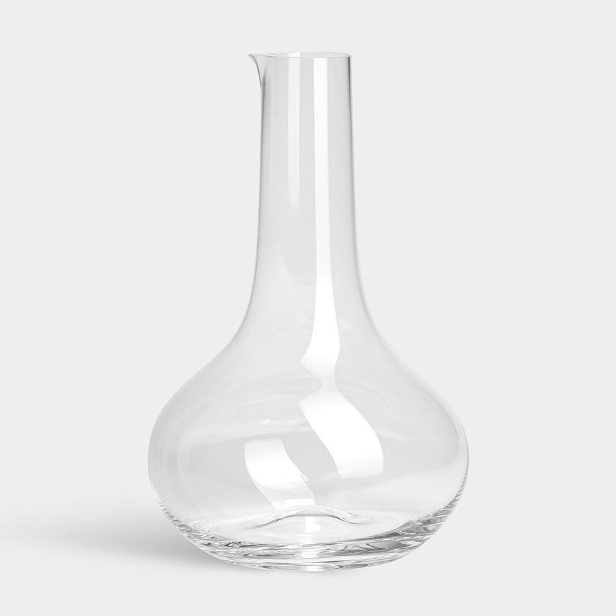 The Orrefors: More Carafe 50oz is an elegant crystal glass piece with a tall, narrow neck and round base, set against a plain light gray background.