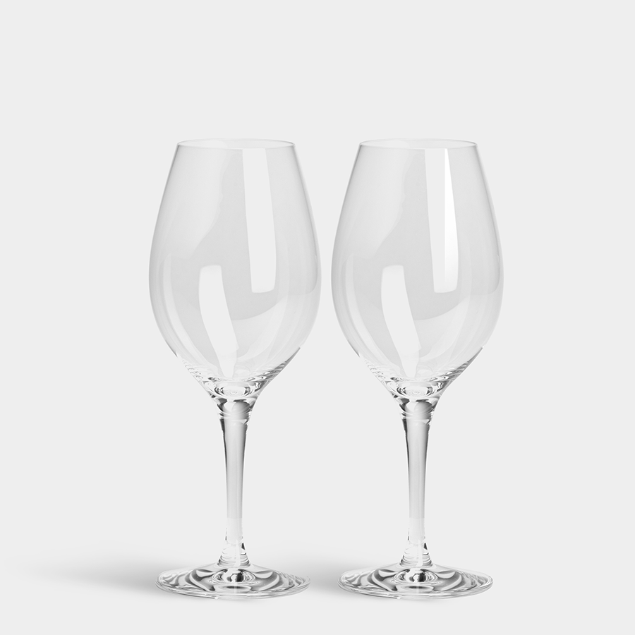 Two elegantly designed Orrefors: More Wine Glasses, 13oz (2-Pack), rest on a plain background.