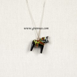 The "Dala Horse Necklace Black" is a handcrafted necklace showcasing a pendant shaped like a black Dala horse, embellished with colorful details reminiscent of Grannas Olsson's iconic designs, set against a light background.