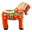 The Nils Olsson Red Swedish Dala Horse "Färnäshästen" (14 cm) is a handcrafted wooden figure painted with green, white, red, and yellow folk-art patterns—typical of Sweden’s decorative tradition. Made in Sweden by Nils Olsson.