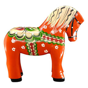 The Nils Olsson Red Swedish Dala Horse "Färnäshästen" (14 cm) is a handcrafted wooden figure painted with green, white, red, and yellow folk-art patterns—typical of Sweden’s decorative tradition. Made in Sweden by Nils Olsson.