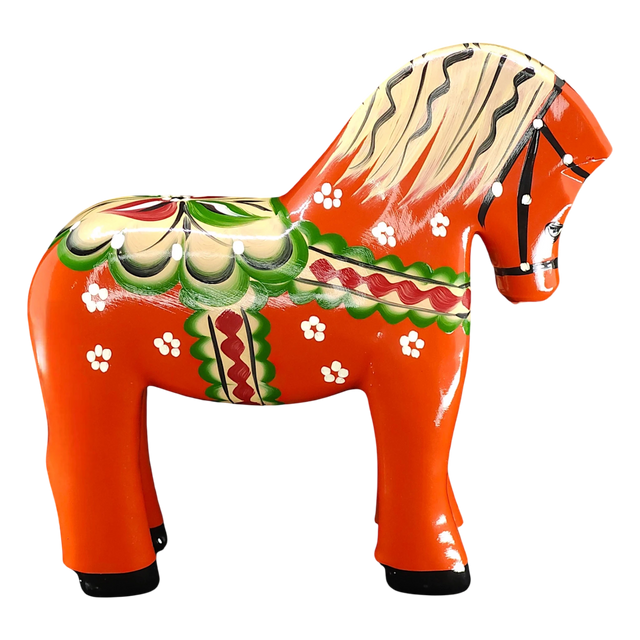 The Nils Olsson Red Swedish Dala Horse "Färnäshästen" (14 cm) is a handcrafted wooden figure painted with green, white, red, and yellow folk-art patterns—typical of Sweden’s decorative tradition. Made in Sweden by Nils Olsson.
