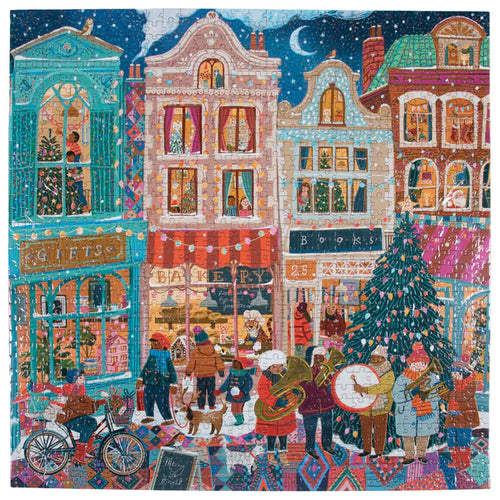 A vibrant depiction of a bustling street scene at night, featuring shoppers, musicians, and a beautifully adorned Christmas tree. This lively panorama evokes the charm of a Victoria Ball or the joy of assembling the Happy Holiday 1,000-piece Puzzle, filled with festivity and cheer.