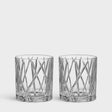 The Orrefors City Old Fashioned Glass 8oz 2-Pack features clear faceted tumblers with crisscross designs, embodying a stylish nod to the city old-fashioned aesthetic.