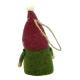 A hand-felted tomte gnome ornament with a tall red hat, green body, and wooden hands hanging by a string loop on a white background.