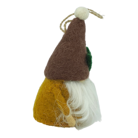 Side view of a hand-felted tomte ornament with a brown hat, yellow body, white beard, green patch on the side, and attached string loop for hanging.