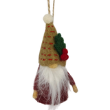 Tomte gnome ornament made of natural wool, featuring a long white beard, red outfit, tan hat decorated with a leaf and berries, hanging by a string.