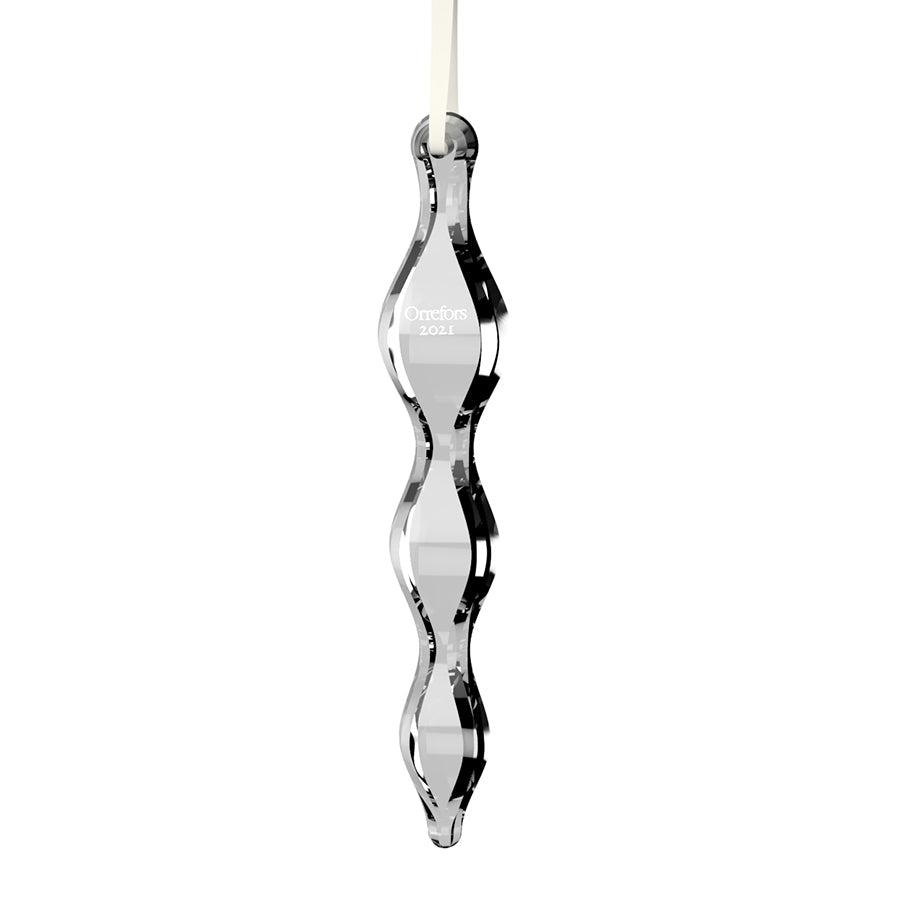 The Orrefors: Annual Ornament Icicle gleams with Orrefors 2021 elegantly etched and hangs gracefully on a ribbon.