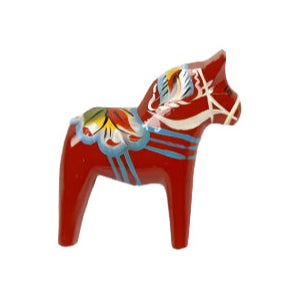 The 1.25 Red Swedish Dala Horse Pin, adorned with colorful kurbits decoration, rests on a light textured background.