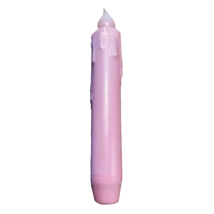 A pink hand-dipped beeswax 7 tapered LED timer candle with wax drip details and a white flame tip, perfect for adding farmhouse décor.