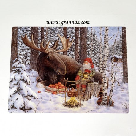 Santa and Moose are snugly situated in a snowy forest, tending to a small campfire with food. Birch trees surround them, and a wooden cabin emerges through the winter landscape. It feels like they've come straight from the "Placemat: Jan Bergerlind Santa & Moose in a Snowy Forest," encapsulating the enchantment of nature.