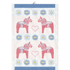 Ekelunds Svea Tea Towel, crafted from organic cotton, features four red Dala horses, blue and yellow daisies, heart shapes, and a blue border. This 14x20 woven textile blends traditional charm with modern eco-friendly craftsmanship.