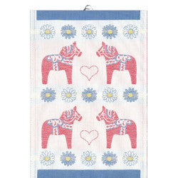 Ekelunds Svea Tea Towel, crafted from organic cotton, features four red Dala horses, blue and yellow daisies, heart shapes, and a blue border. This 14x20 woven textile blends traditional charm with modern eco-friendly craftsmanship.