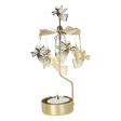 Rotary candle holder with gold flying angels above a lit tealight, metallic blades at the top, and a Scandinavian design.
